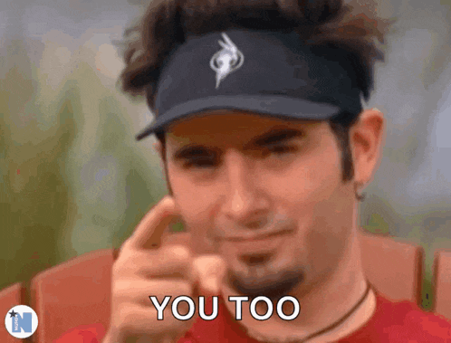 a man wearing a hat and a visor says you too