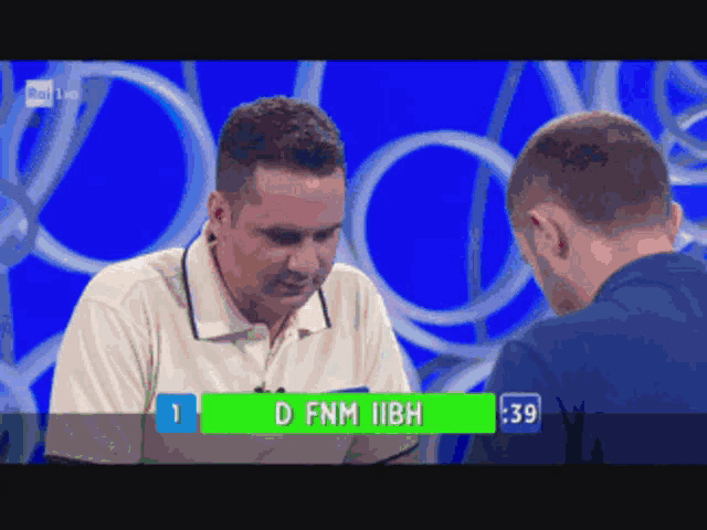 two men are playing a game and one of them has the name d fnm iibh on the green screen