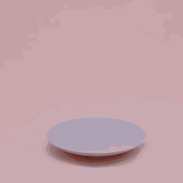 four donuts stacked on top of each other on a white plate