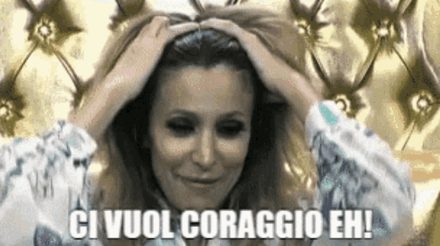 a woman with her hands on her head and the words ci vuol coraggio eh on the bottom