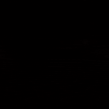a blurred image of a star in the middle of a dark space