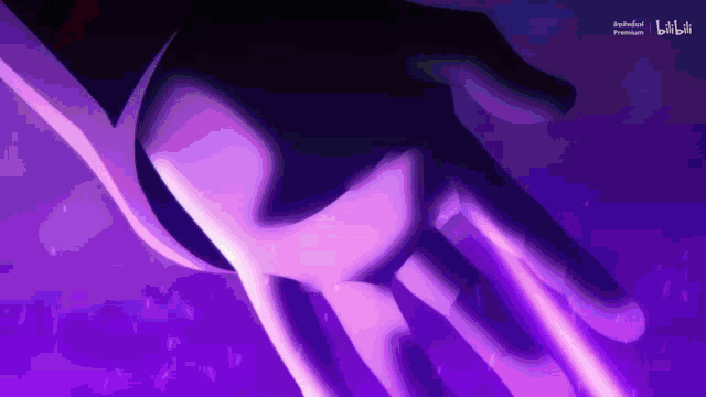 a close up of a person 's hand against a purple background that says bilibili premium