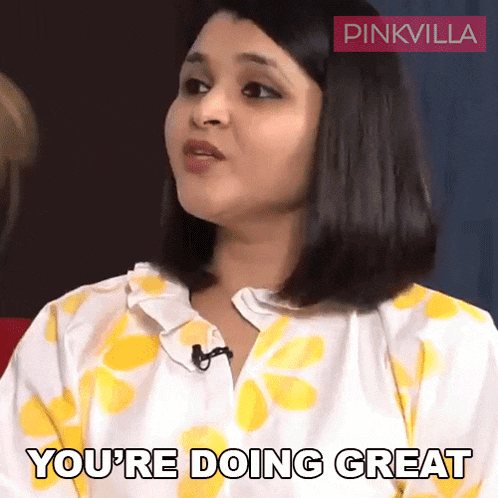 a woman says " you 're doing great " while wearing a yellow and white shirt