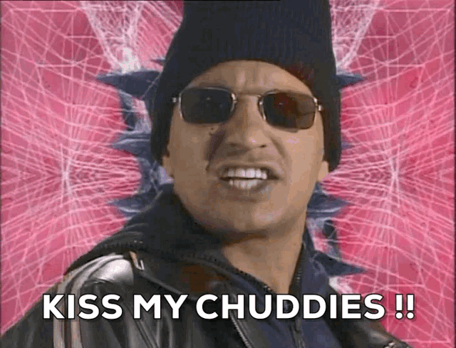 a man wearing sunglasses and a hat says kiss my chubbies