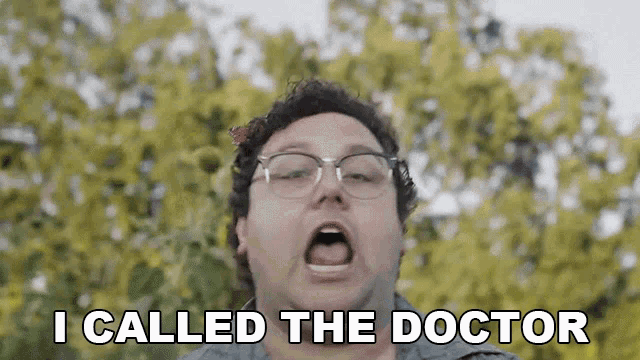 a man with glasses and a butterfly in his hair says i called the doctor