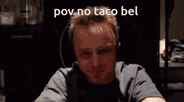 a man sits in a messy room with the words pov no taco bel written above him