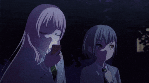 a couple of anime girls standing next to each other