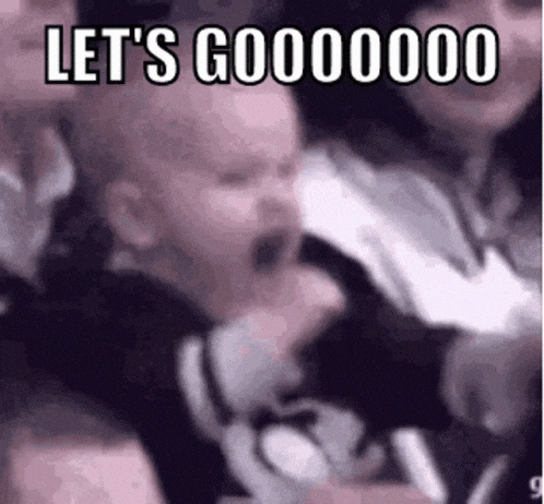 a baby is screaming in a crowd of people with the words `` let 's gooooooo '' written on it .