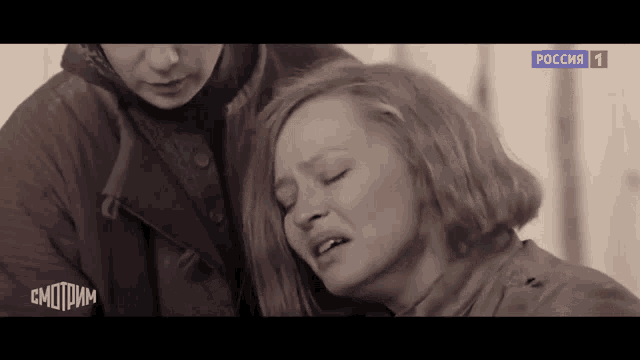a woman is crying in front of a sign that says russia