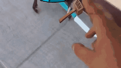 a cartoon drawing of a dinosaur and a hammer with the word baw on it
