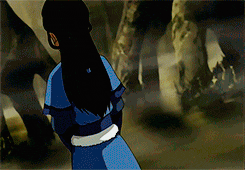 a cartoon of a woman in a blue dress standing in a cave