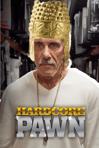 a man wearing a gold helmet and chains stands in front of a poster for hardcore pawn