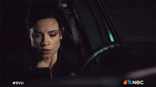 a woman sitting in a car with the nbc logo on the bottom right