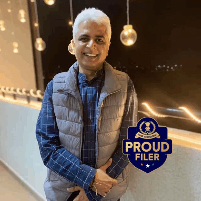 a man standing next to a sign that says proud filer on it