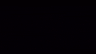 a fireworks display with a red and white firework in the middle