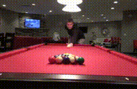 a man is playing pool on a pool table