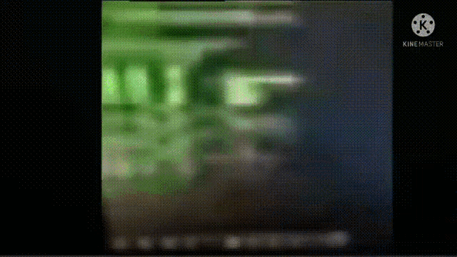a blurred image of a green and black background with a few lines on it .
