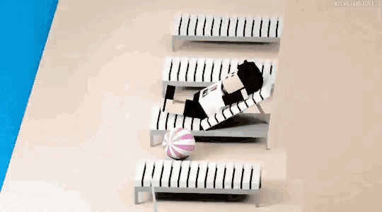 a pixel art illustration of a person laying on a lounge chair on a beach .