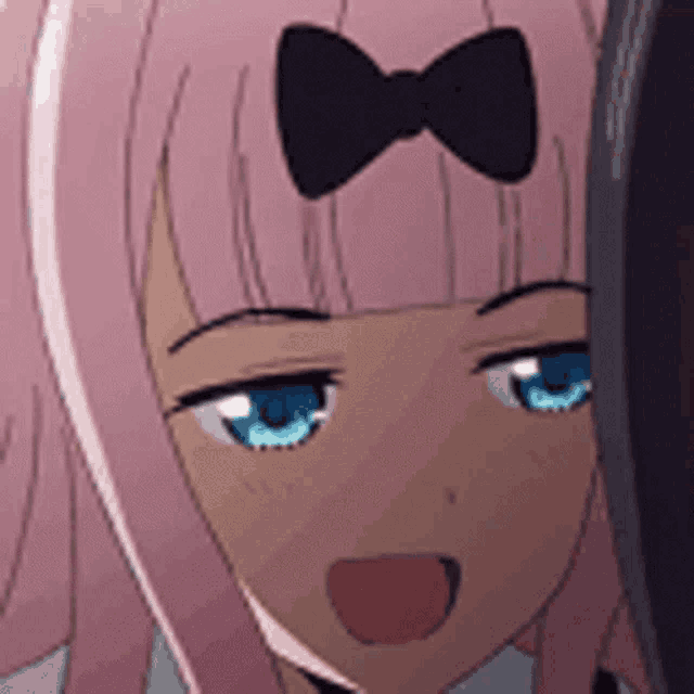 a close up of a anime girl with pink hair and blue eyes with a bow in her hair .