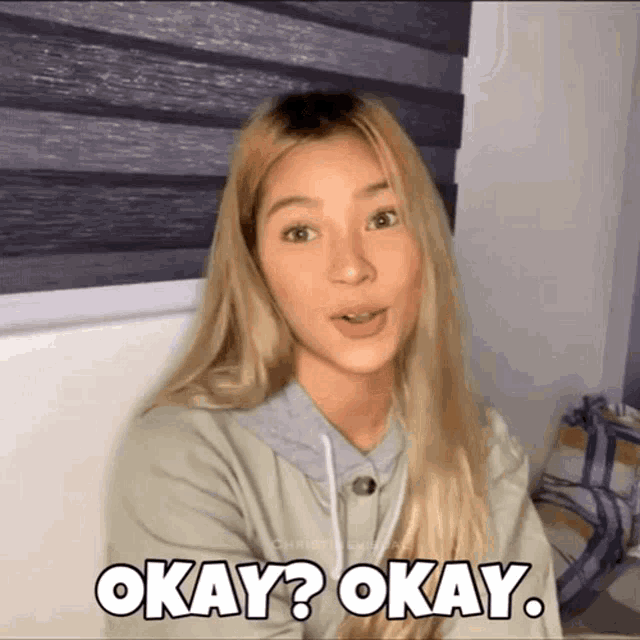 a woman with blonde hair says okay okay .