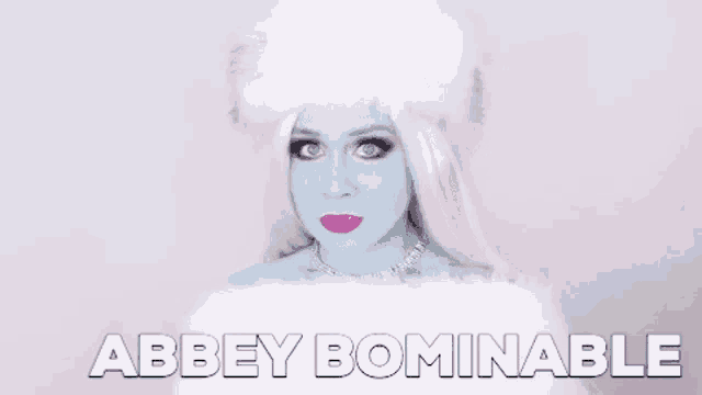 a woman with blue makeup and white hair is wearing a white fur coat and a fur hat .