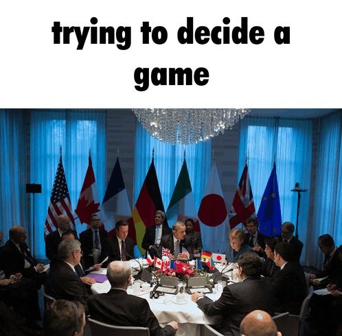 a group of people are sitting around a table with flags on it and the words trying to decide a game above them