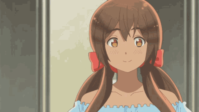 a girl with brown hair and a red bow in her hair is smiling