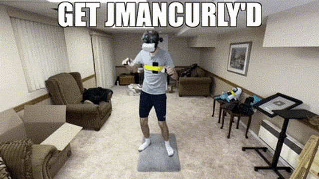 a man wearing a virtual reality headset in a living room with the words get jmancurly 'd written above him