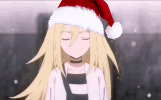a blonde anime girl is wearing a santa hat .