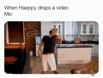 a man is dancing in a kitchen with the caption " when haeppy drops a video me : "