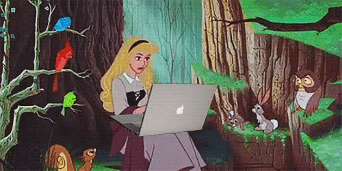 a cartoon princess is using an apple laptop
