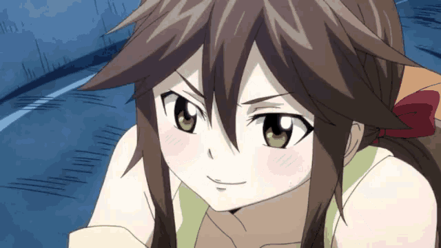 a close up of a girl with brown hair and green eyes looking at the camera .