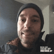 a man wearing a beanie and a jacket is made with fakeme app .