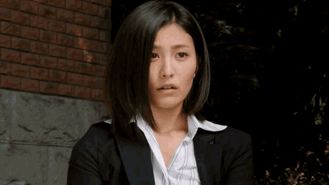 a woman making a funny face with her hands