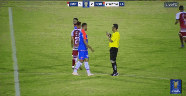 a soccer player with the number 19 on his jersey is shown a red card