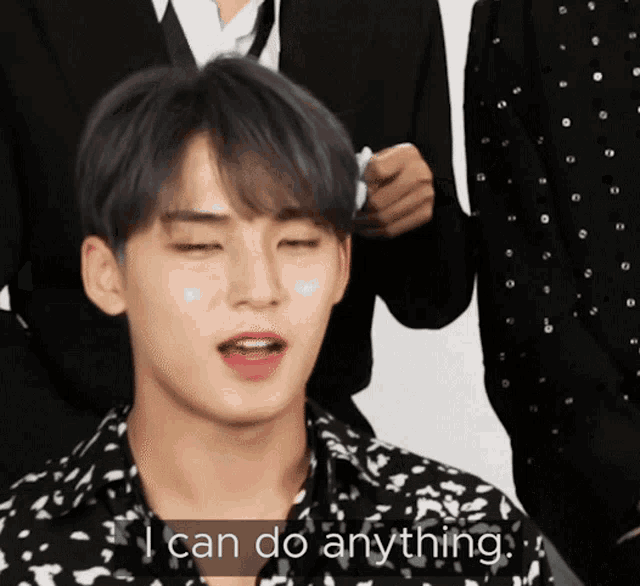 a man says i can do anything in front of a man in a suit