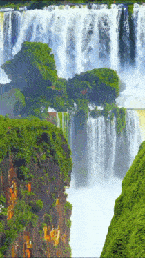 a waterfall in the middle of a forest