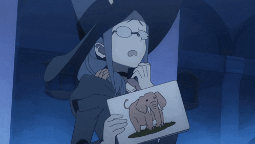 a witch holding a picture of an elephant