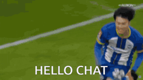 a soccer player is running on a field and says hello chat .