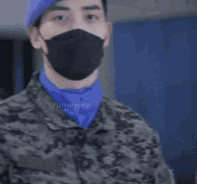 a man wearing a mask and a beret is holding a microphone