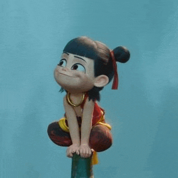 a cartoon character is sitting on top of a wooden pole .