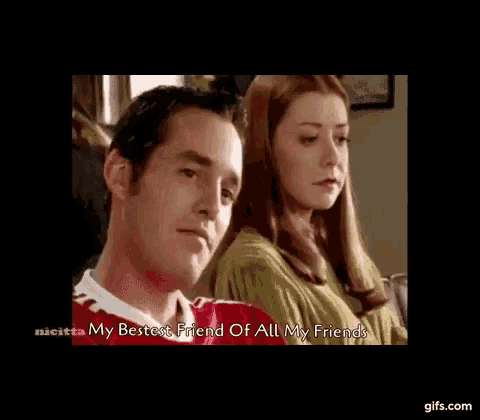 a man and a woman are sitting next to each other .