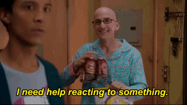 a man is holding a box of candy canes while another man says " i need help reacting to something "