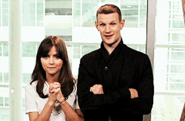 a man and a woman are posing for a picture together