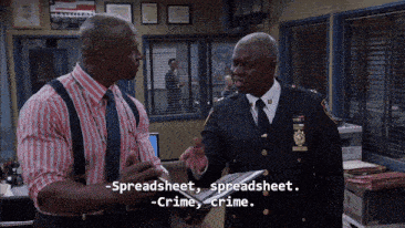 two police officers are talking about spreadsheet and crime
