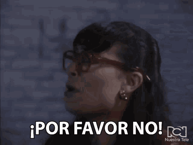 a woman wearing glasses is saying por favor no !