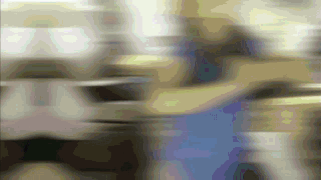 a blurred image of a person 's face with a purple background