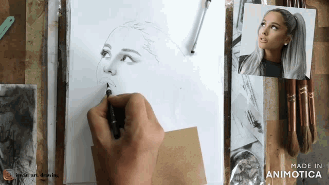 a person is drawing a picture of ariana grande on a piece of paper that says made in animonica