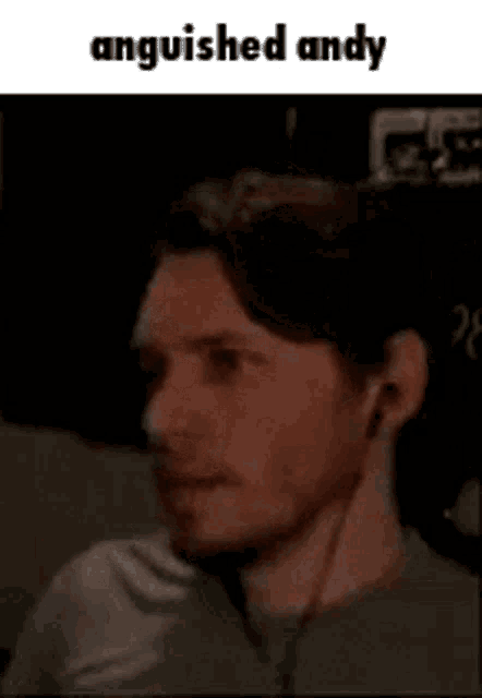 a man is wearing headphones and has anguished andy written above him .
