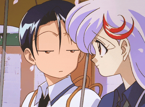 a man and a girl are standing under an umbrella